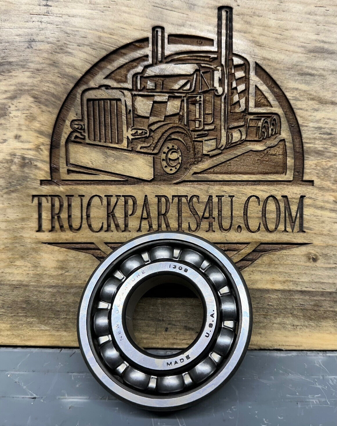 Front view of New Departure 1308 single row ball bearing showing balls and race, 40x90x23 mm, new surplus from DPX Mansfield Ohio