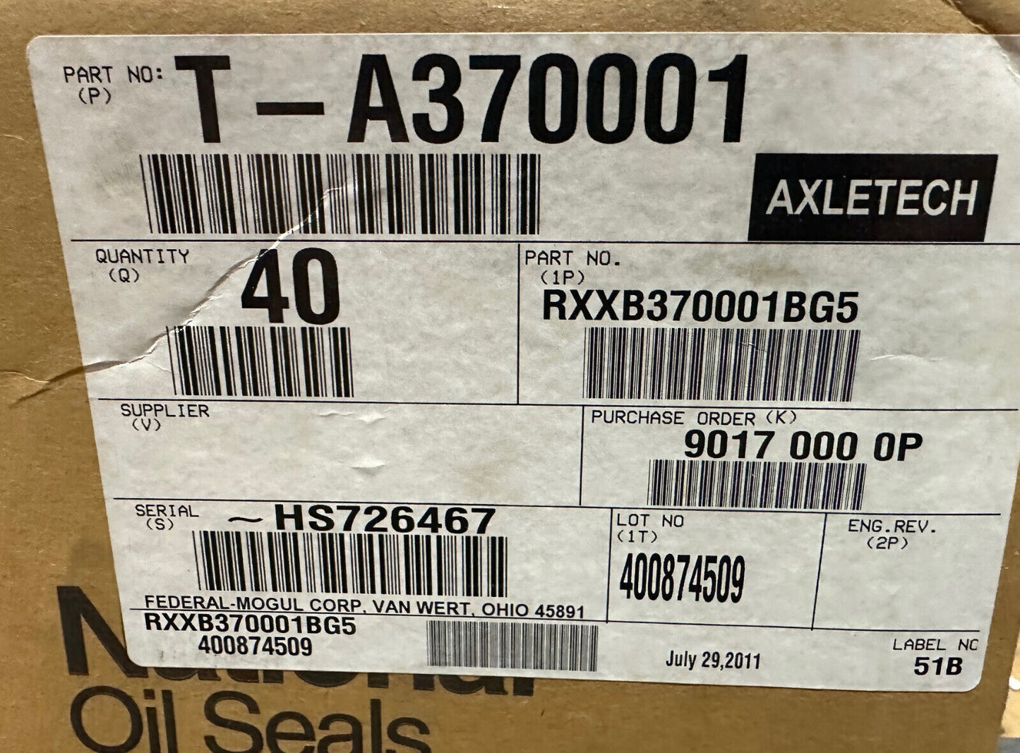 Factory carton label for National/Federal-Mogul wheel seals showing AxleTech ref RXXB370001BG5 and lot/quantity details.