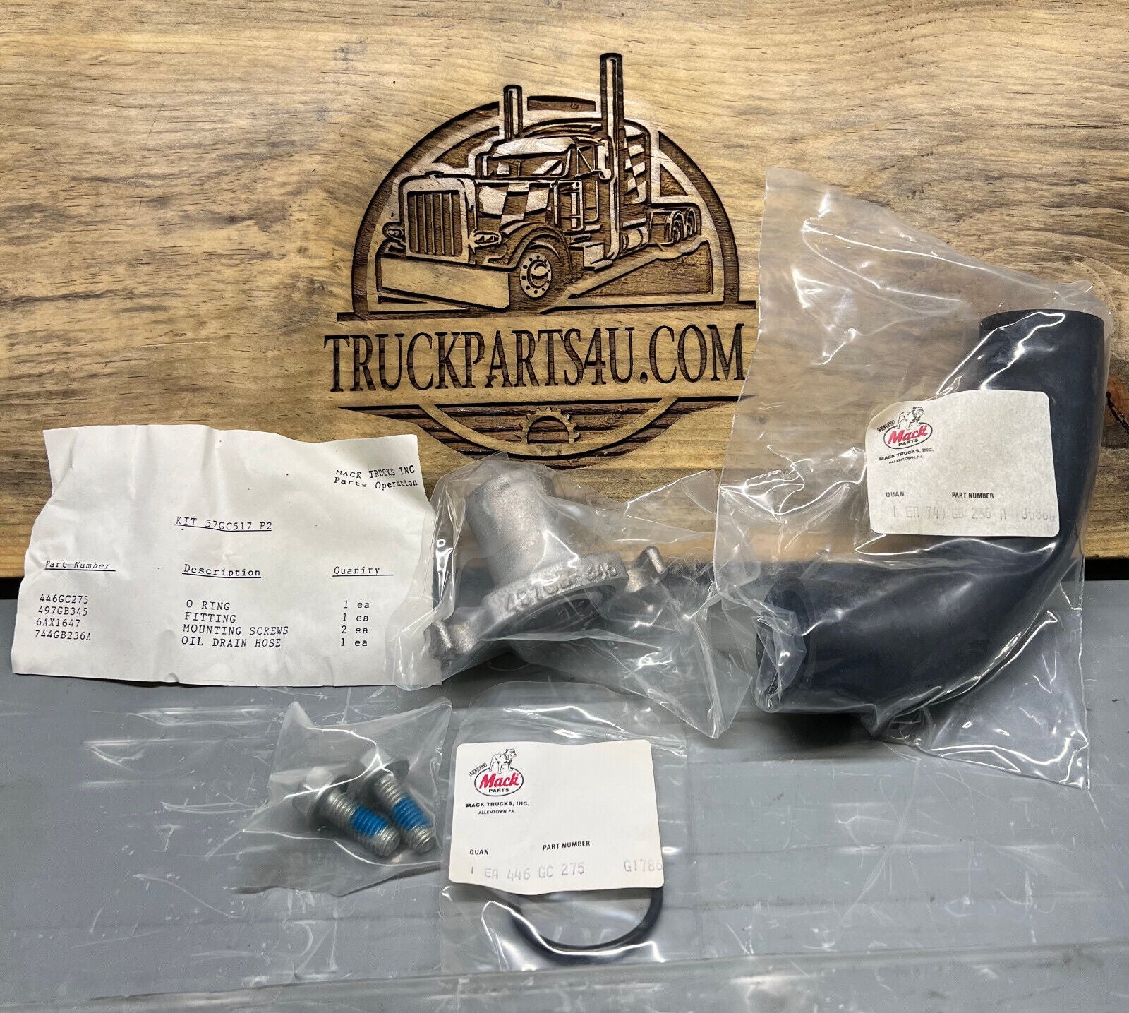 57GC517P2 Mack oil drain kit for E7 – includes hose, fitting, and mounting screws