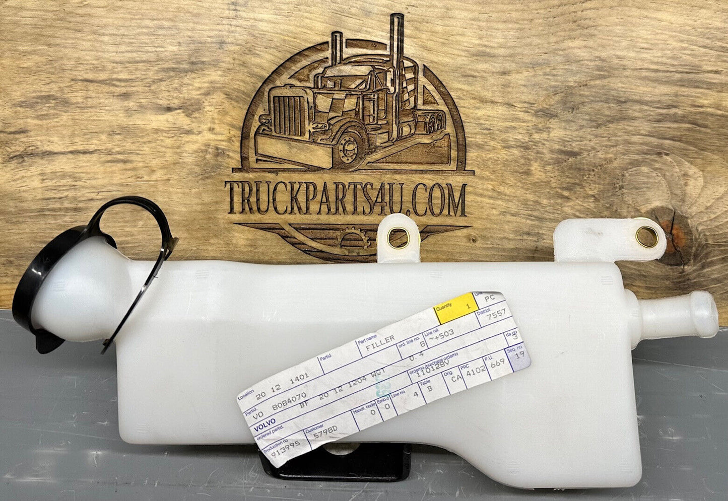 Side view of genuine Volvo 8084070 washer tank – NOS