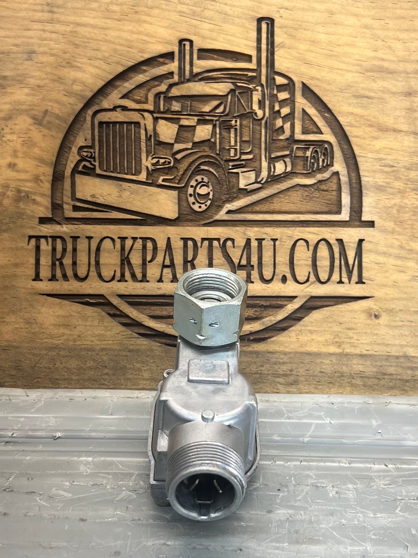 Front connection view of Volvo CE 4960088-5 Kienzle tachometer and hour meter drive gearbox showing threaded input and output fittings