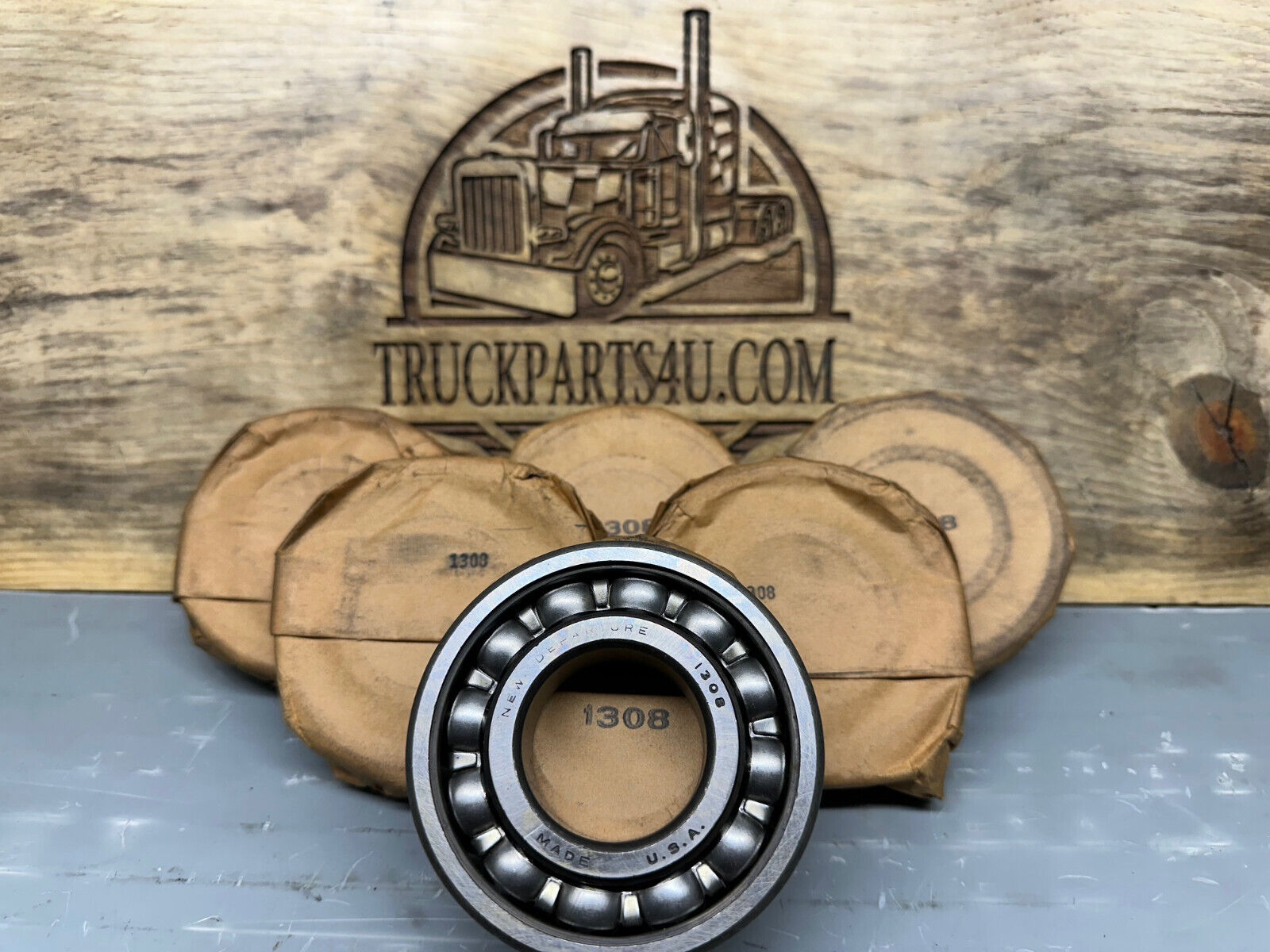 New surplus New Departure 1308 single row radial ball bearing, open design with no snap ring, 40mm bore.