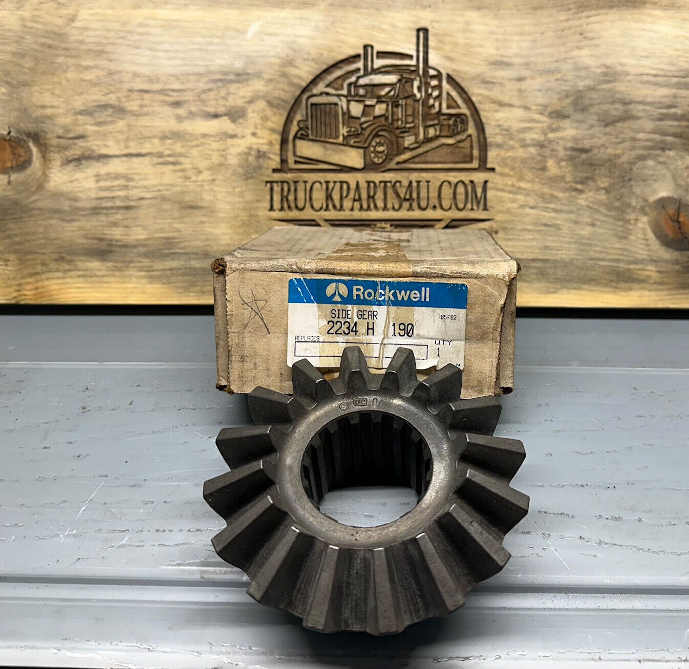 2234H190 Meritor-Rockwell-AxleTech side gear – new genuine OEM shown with original Rockwell box on TruckParts4U.com burnt board