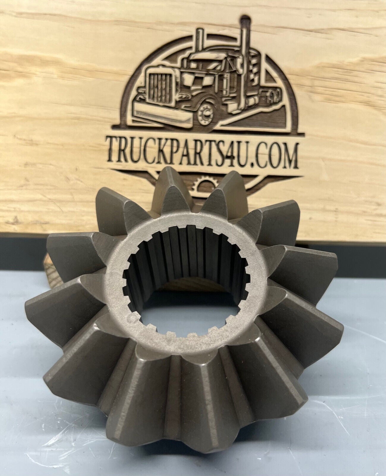 Close-up of 2234Q511 Meritor/Rockwell/AxleTech axle side gear, 20-spline, new genuine OEM component