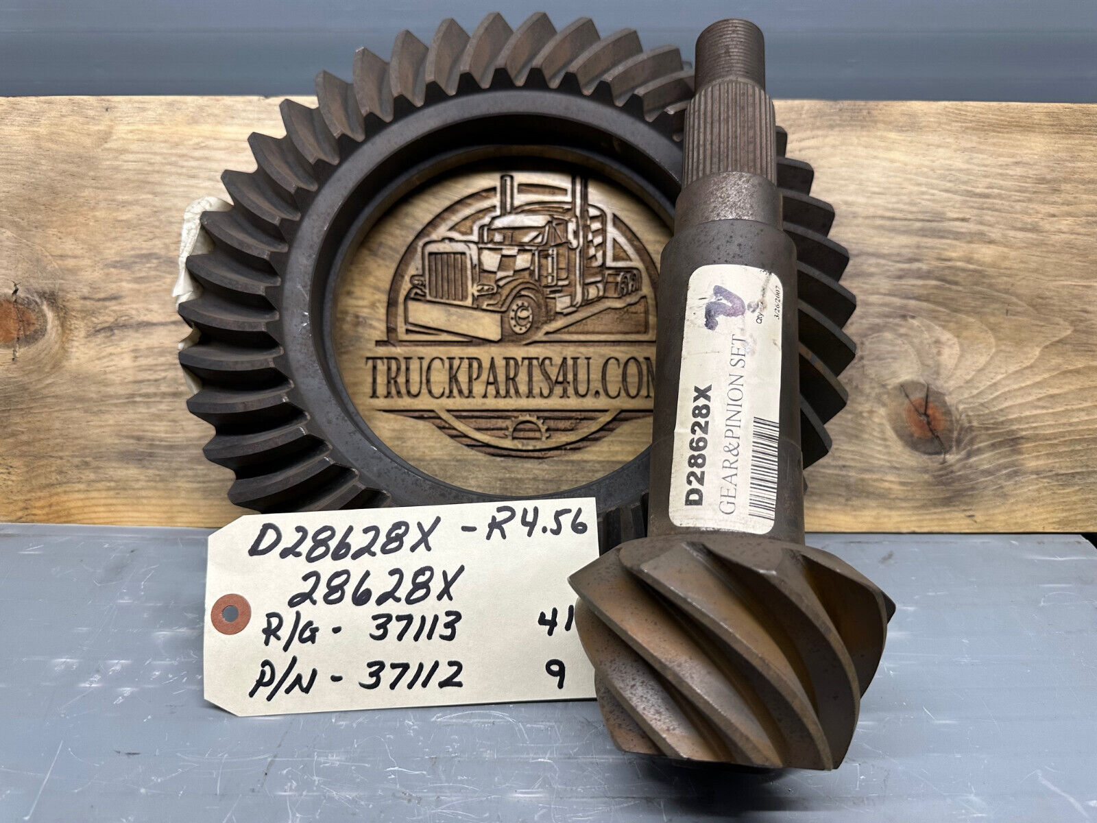 Dana Spicer 28628X / D28628X ring and pinion set, 4.56 ratio (RG 37113–41T, PN 37112–9T), new off-highway gearset shown with ID tag