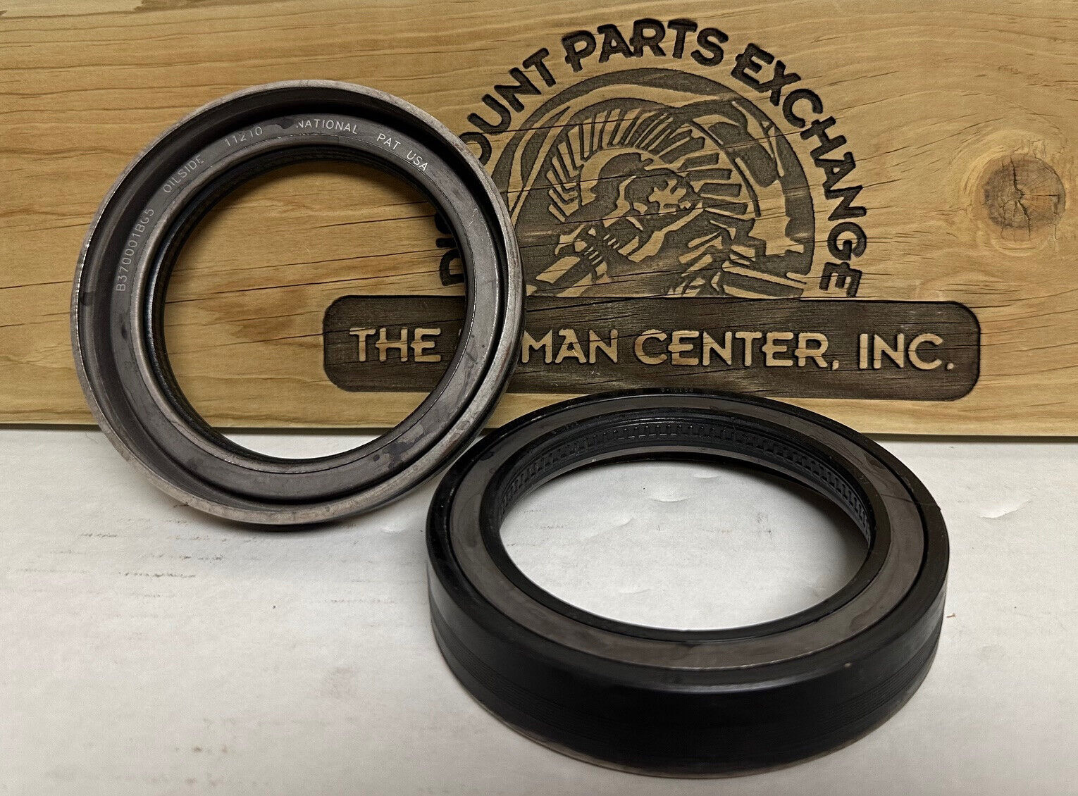 National 370001A wheel seal, Genuine Federal-Mogul, shown inner and outer views for heavy-duty wheel-end applications.