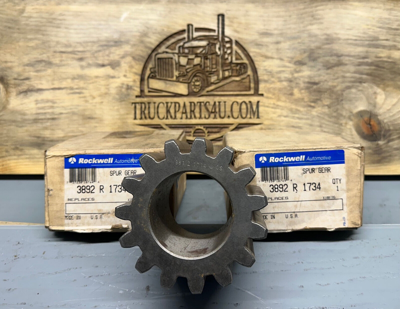 3892R1734 Meritor-Rockwell-AxleTech spur gear – new genuine OEM shown with original Rockwell boxes on TruckParts4U.com burnt board