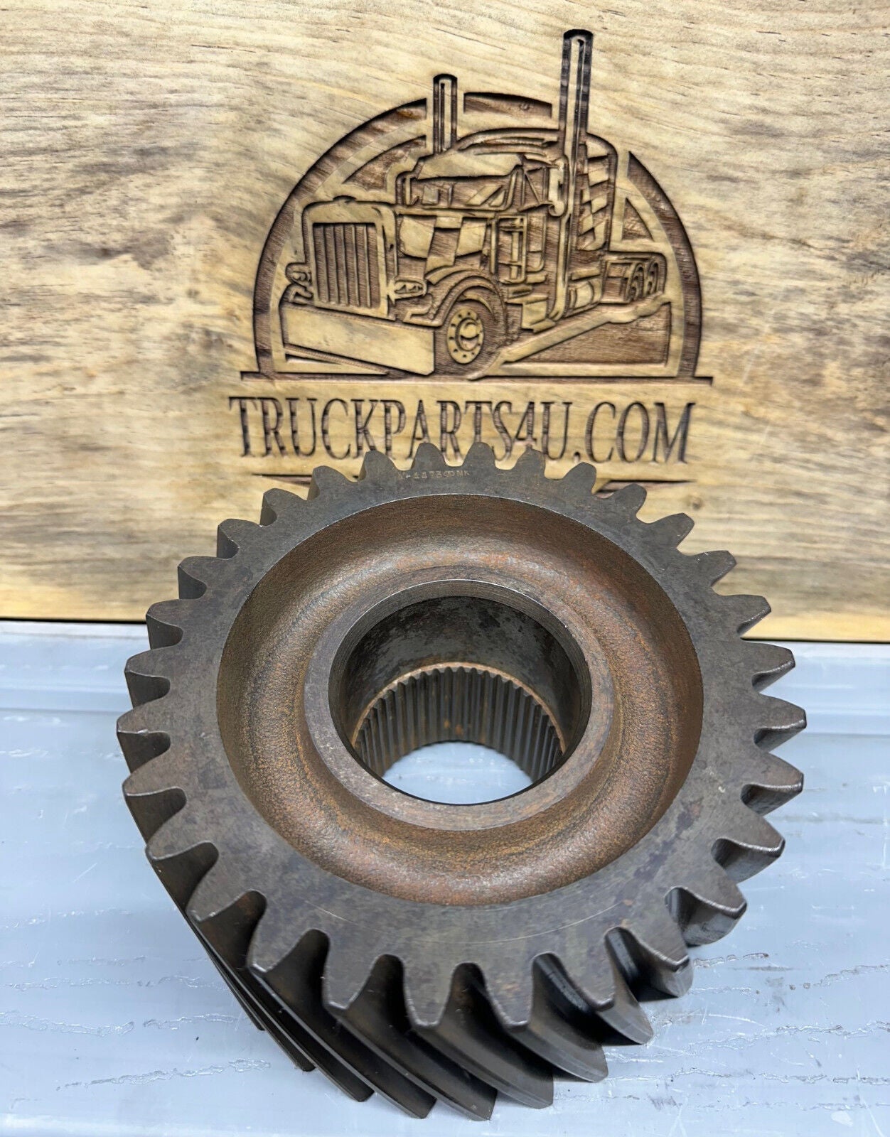 Front view of 3892A4473 Meritor/Rockwell/AxleTech helical gear, new genuine OEM for Rockwell transfer case in M923/M939 military trucks