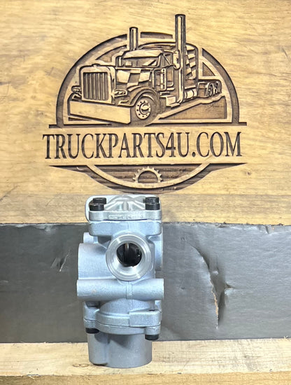 Port-side view of Meritor WABCO 400 611 002 0 ABS modulator valve for heavy-duty truck air brake systems, shown against TruckParts4U.com branded wood background.