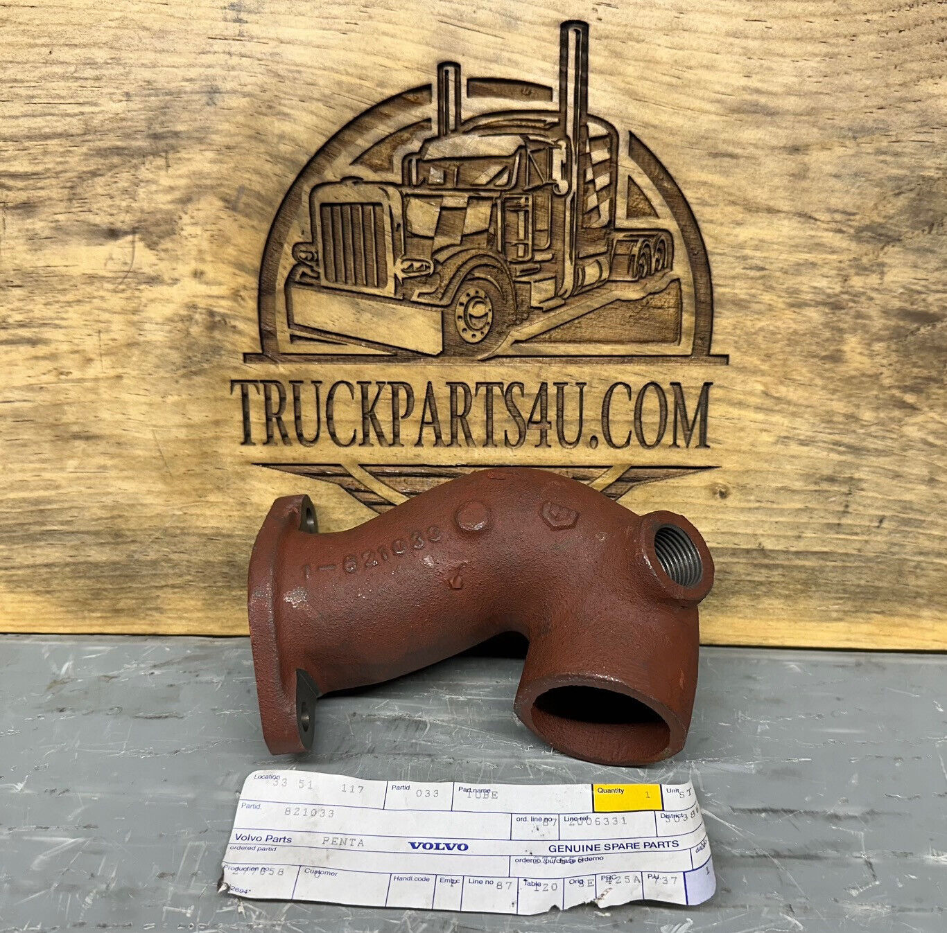 Front view of Volvo Penta 821033 pipe elbow – new genuine NOS marine engine fitting