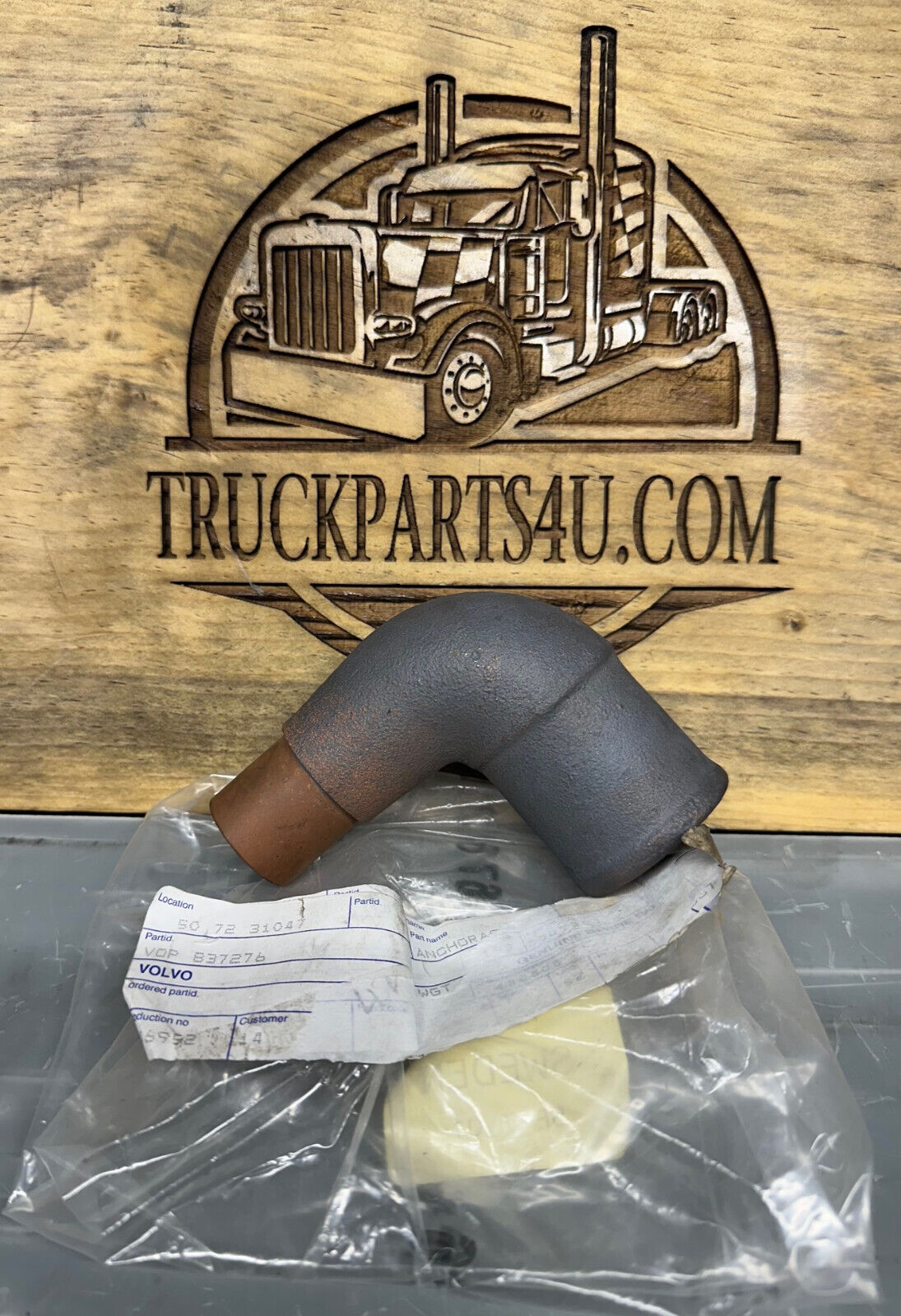 Genuine Volvo Penta 837276 sea water pump anchorage mounting bracket, new old stock NOS, shown with original packaging and TruckParts4U logo