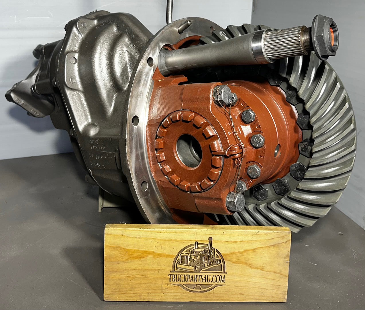 DS402 Eaton Dana-Spicer front (forward) differential remanufactured by DPX, shown on branded wooden block – full view