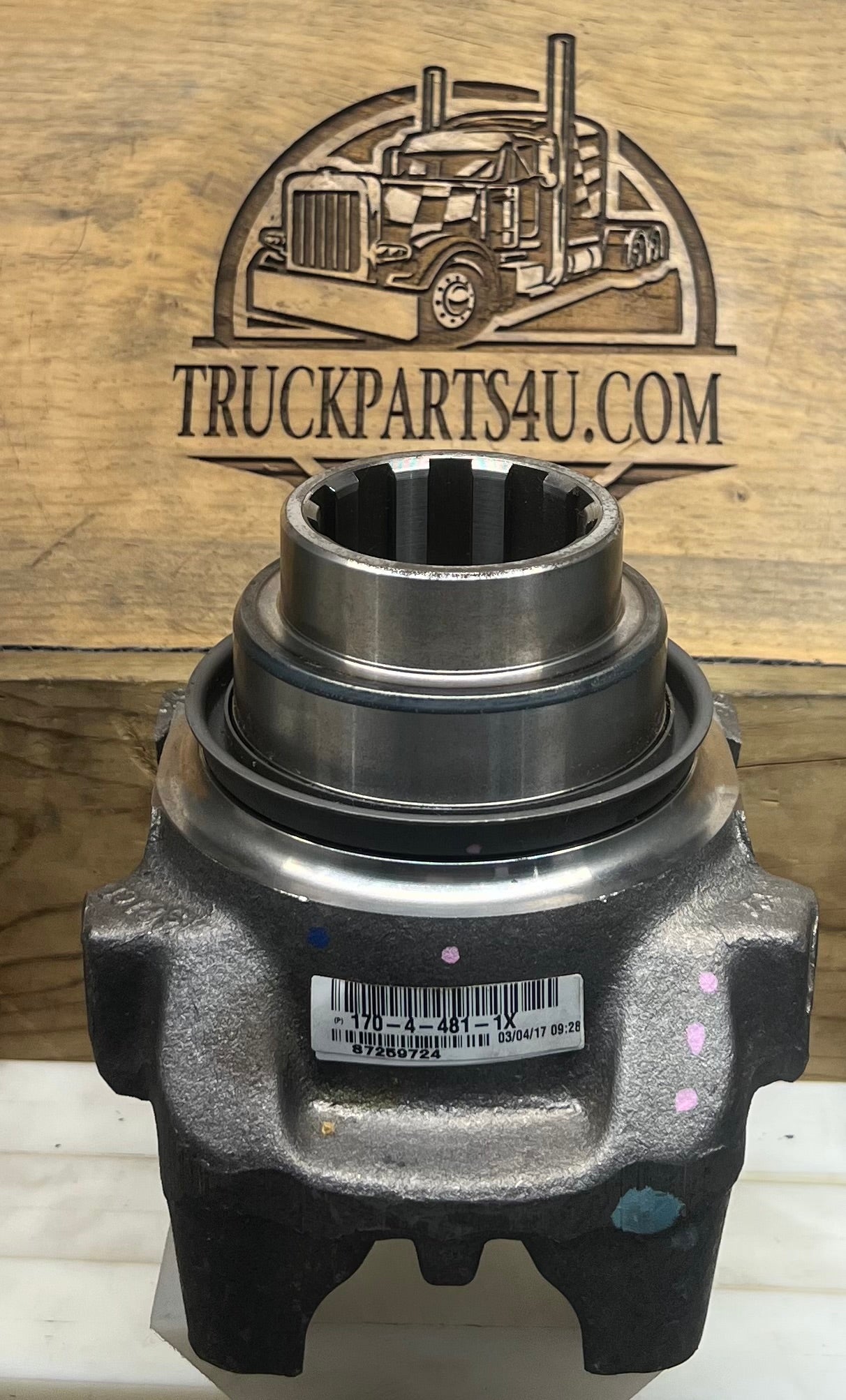 Identification view of genuine Dana Spicer SPL170 end yoke showing part number 170-4-481-1X label and 10-spline output hub