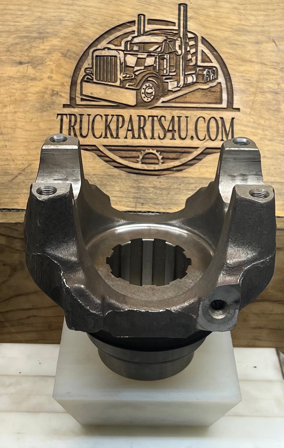 Front view of genuine Dana Spicer 170-4-481-1X SPL170 manual transmission output end yoke showing the 10-spline bore and four threaded mounting holes