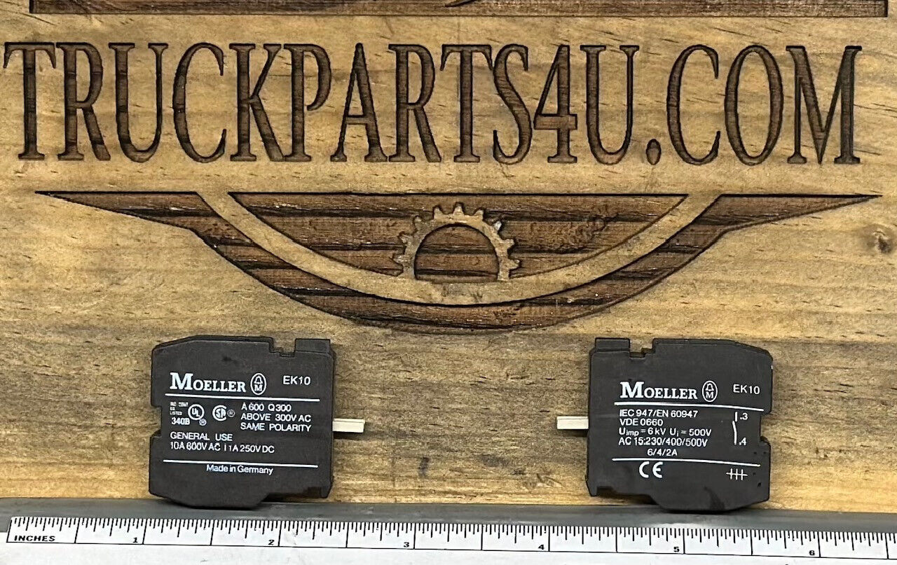 Close-up of EK10 Moeller contact block showing markings and size comparison – new genuine OEM surplus