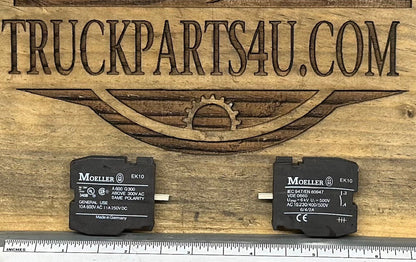 Close-up of EK10 Moeller contact block showing markings and size comparison – new genuine OEM surplus