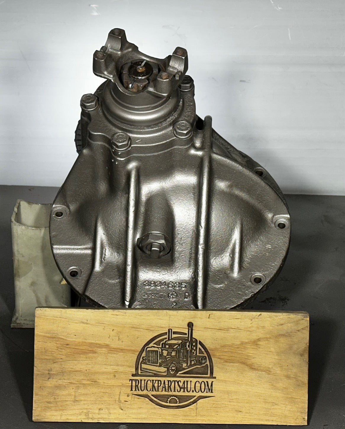 Side view of rebuilt GM Eaton HO72 / H072 differential carrier showing main housing casting number 393465 and installed snubber bolt. Inspected internals, functional condition. Outright sale from Ohio's premier heavy-duty drivetrain rebuilder.