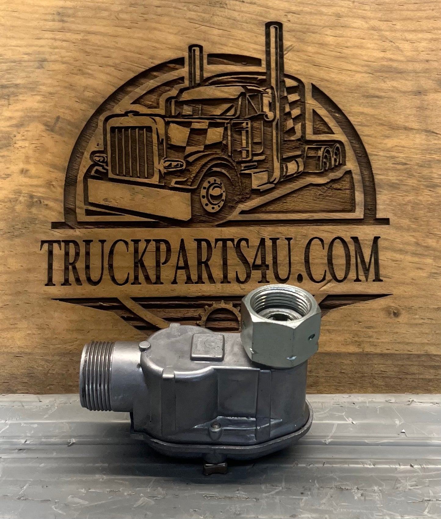 Side view of genuine Volvo CE 4960088-5 Kienzle mechanical tachometer and hour meter right-angle drive gearbox