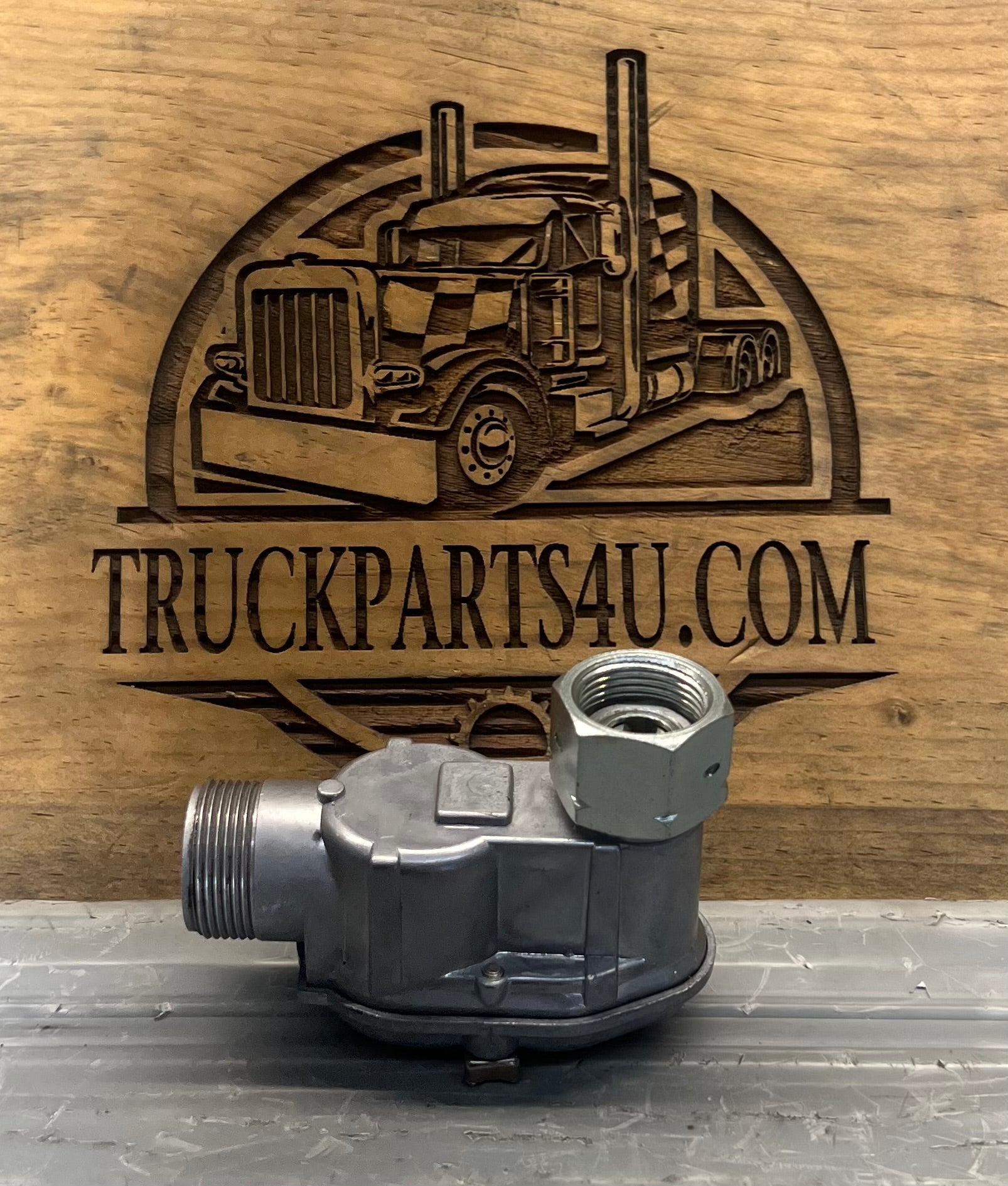 Side view of genuine Volvo CE 4960088-5 Kienzle mechanical tachometer and hour meter right-angle drive gearbox