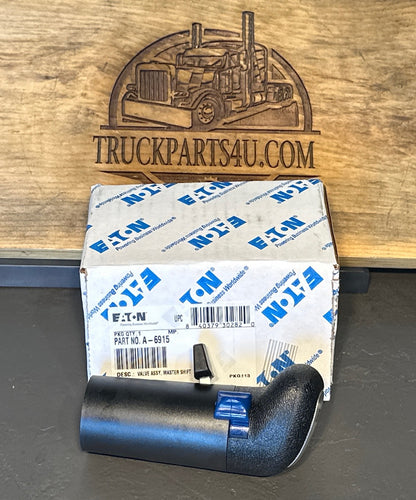 A-6915 Eaton Fuller shift knob on its sidet on factory box with flippers visible



