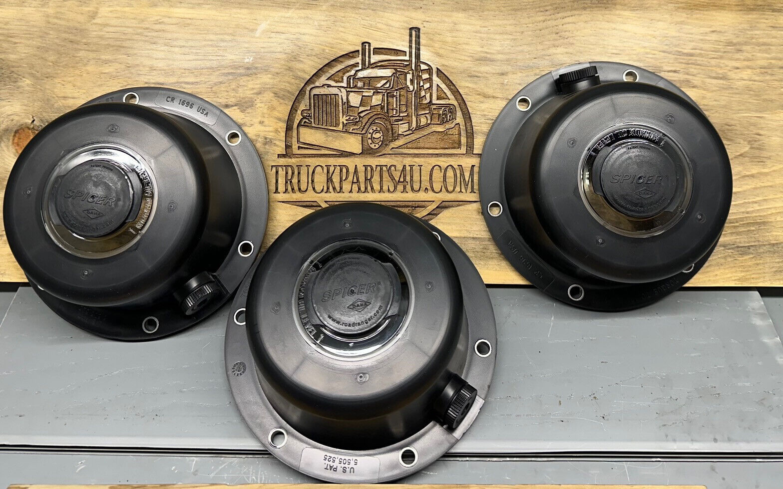 SKF CR1696 hub cap with gasket for TN trailer axle, 6-bolt on 6.75" BC; replaces Stemco 343-4195 and Spicer 976612 — front view with multiple caps.